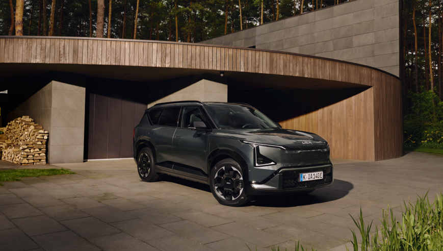 A parked EV5 in front of a home