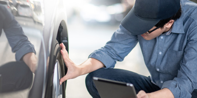 Man checking tyre