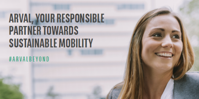The cover page of the Sustainability Report 2022: A smiling woman charging an electric vehicle