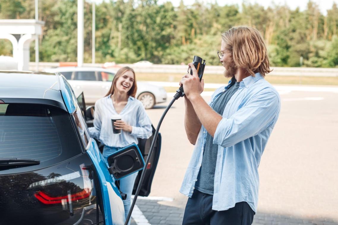 Couple with electric car