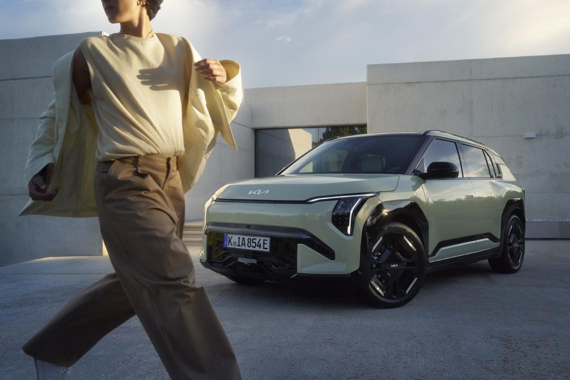 Parked EV3 with a running women