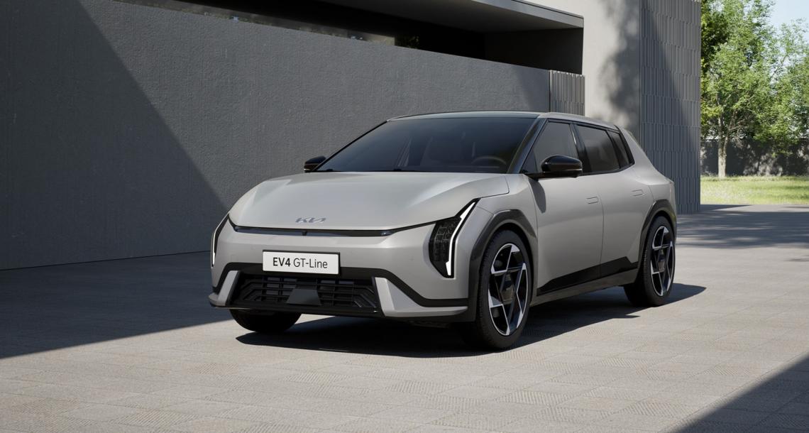 A parked EV4 next to a building